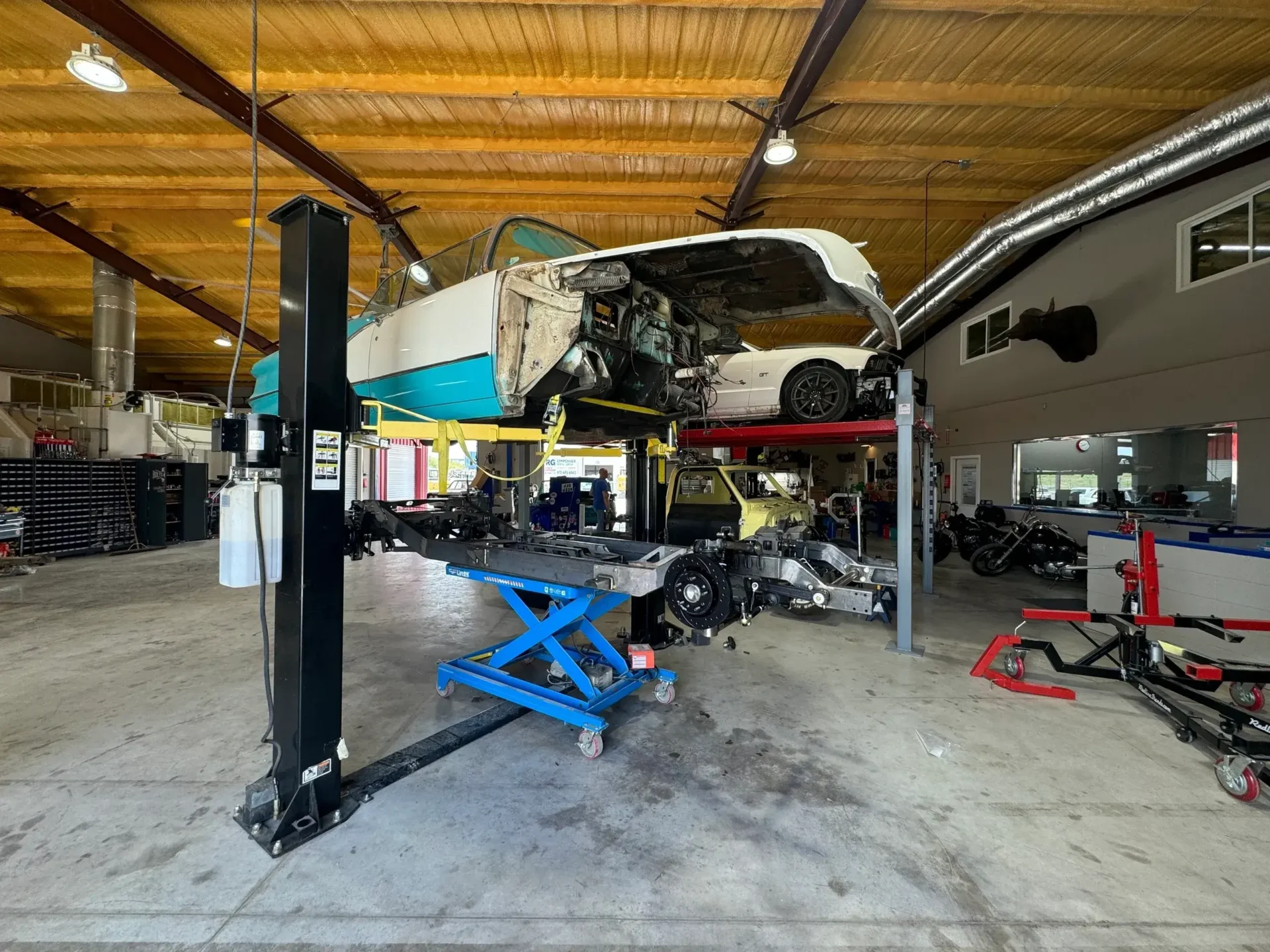 A car is being worked on in the garage.