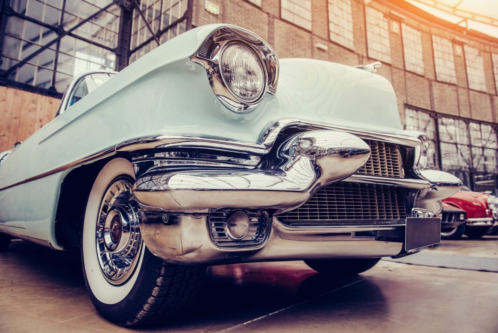 A close up of the front end of an old car